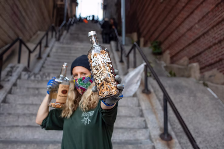 Person holding Absolut New York bottle