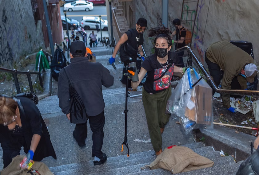 Community cleanup event on city steps